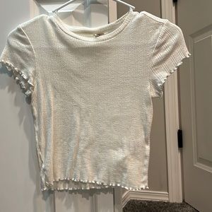 white crop top. a little see through but cute with something under it!